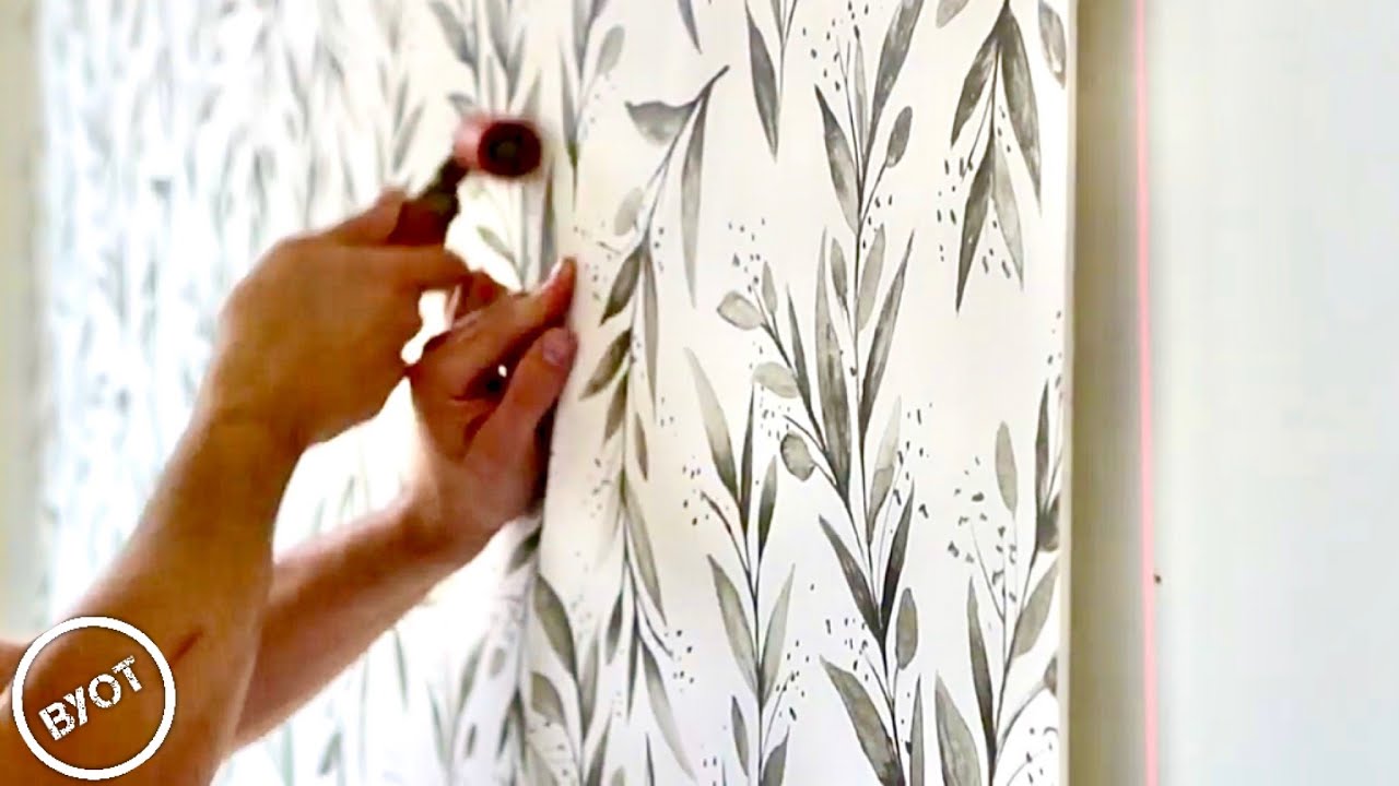 Wallpaper installation detail during a professional interior project